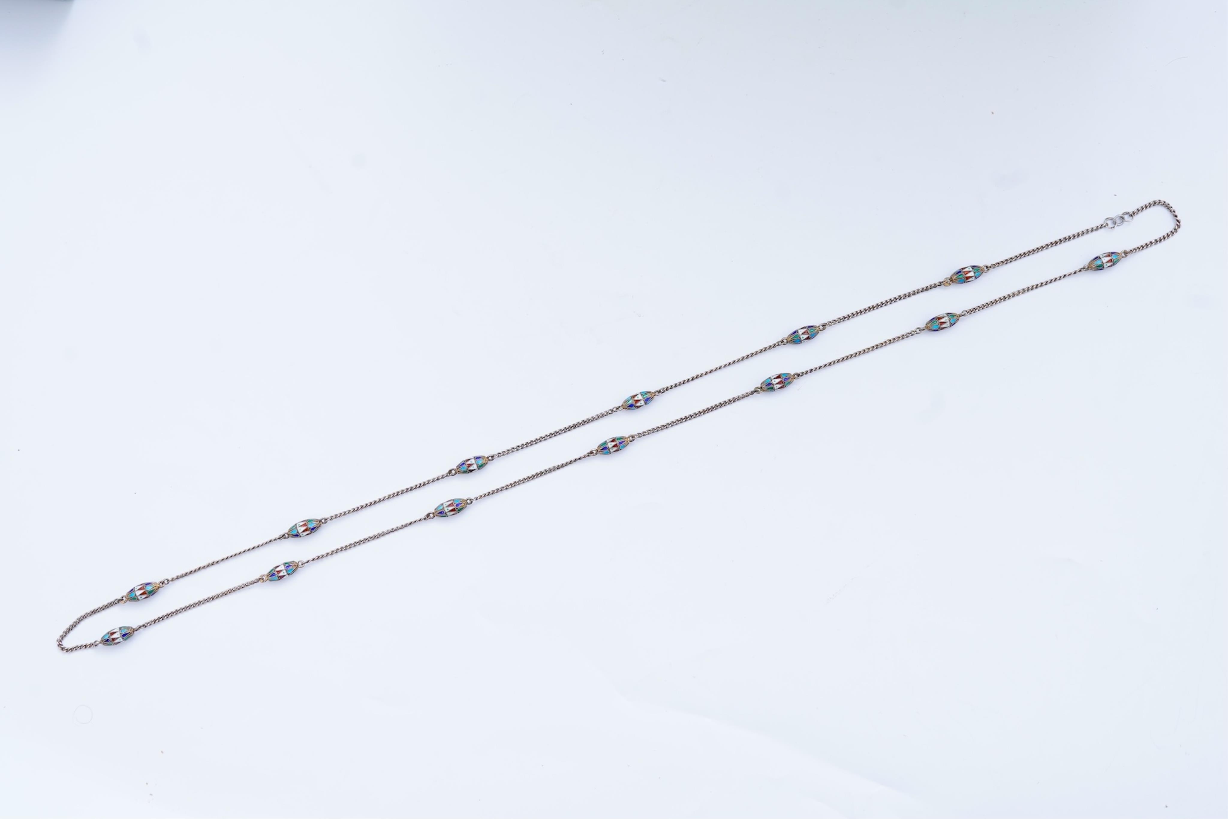 A silver and enamel long chain necklace, Russia, early 20th century